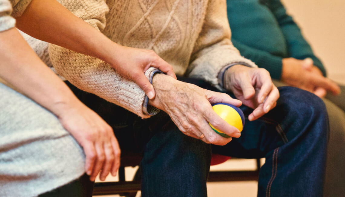 someone holding a small ball