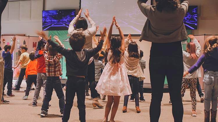 Children engaging in audio visual class exercise 