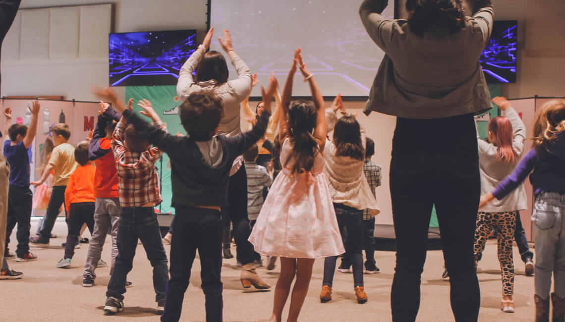 Children engaging in audio visual class exercise 